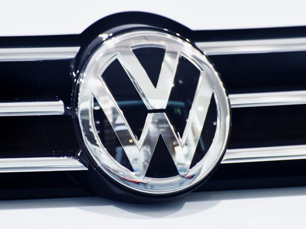 The emblem of Volkswagen is displayed with its vehicle at a show room in Tokyo on July 28, 2016.
Toyota is in danger of losing its crown as the world's biggest automaker this year as sales fall behind those of German rival Volkswagen, new figures showed on July 28, 2016. / AFP / KAZUHIRO NOGI        (Photo credit should read KAZUHIRO NOGI/AFP/Getty Images)